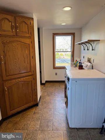 a kitchen with a refrigerator and a sink