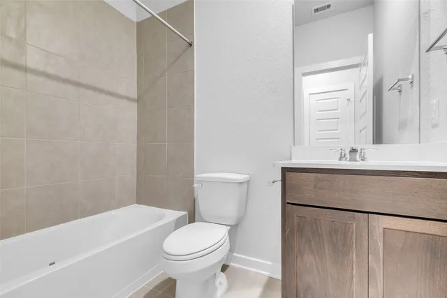 a bathroom with a sink a toilet and a bathtub