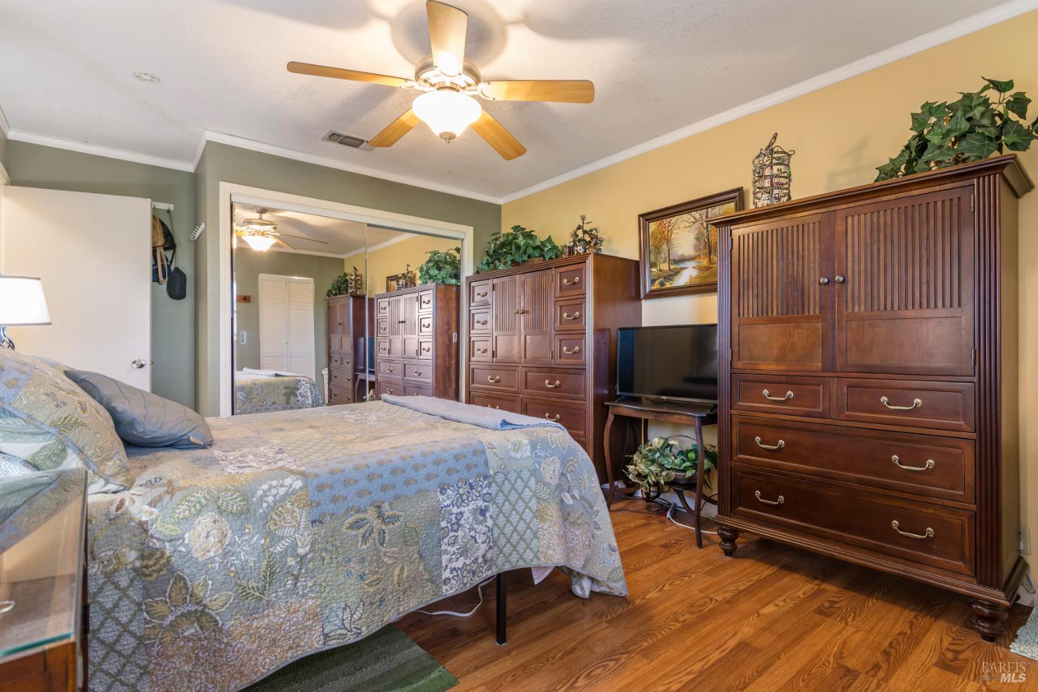 17 Amador Circle Rio Vista, CA 94571 - Photo 28 of 42 a bedroom with a bed and a chandelier