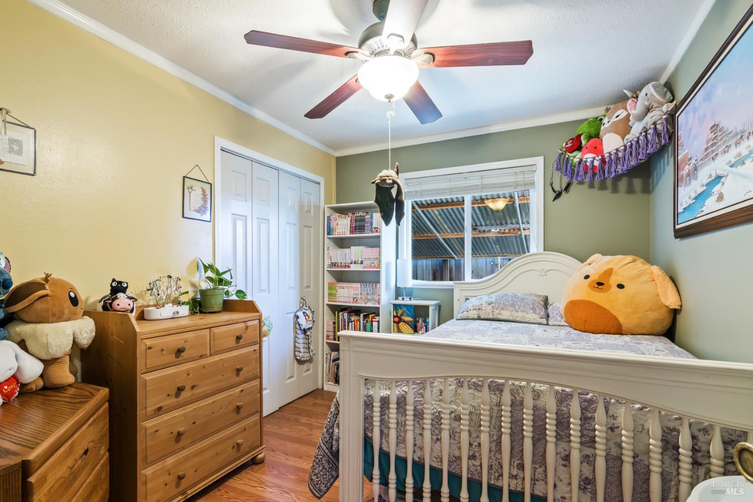 17 Amador Circle Rio Vista, CA 94571 - Photo 31 of 42 a bedroom with a bed and wooden floor