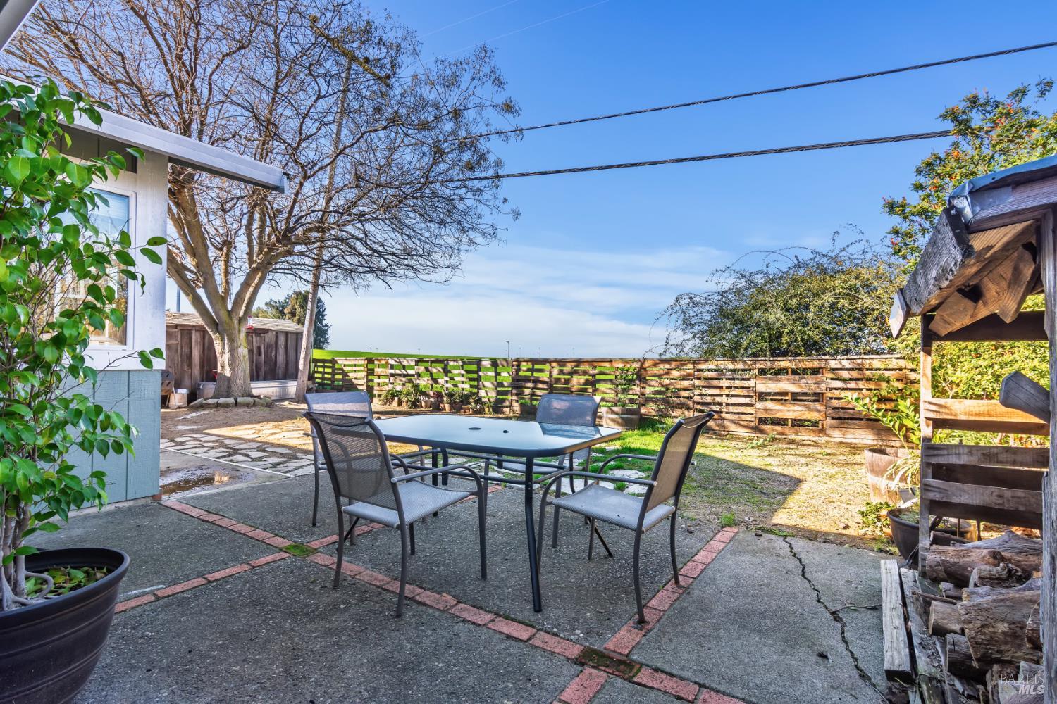 17 Amador Circle Rio Vista, CA 94571 - Photo 37 of 42 a patio with table and chairs and potted plants