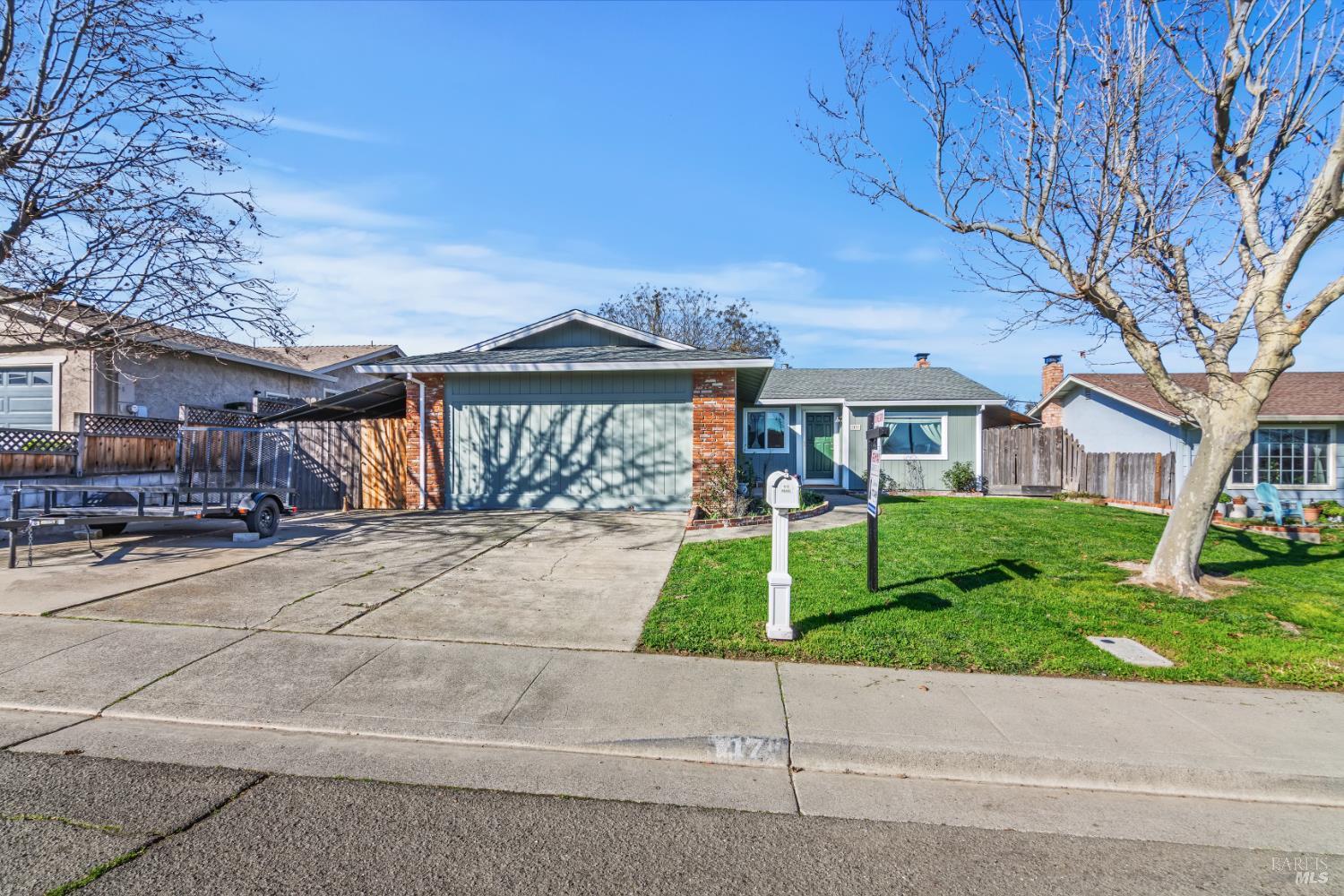17 Amador Circle Rio Vista, CA 94571 - Photo 4 of 42 a front view of a house with a yard and potted plants