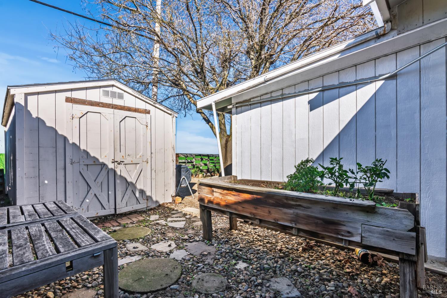 17 Amador Circle Rio Vista, CA 94571 - Photo 41 of 42 a wooden bench sitting in front of a building