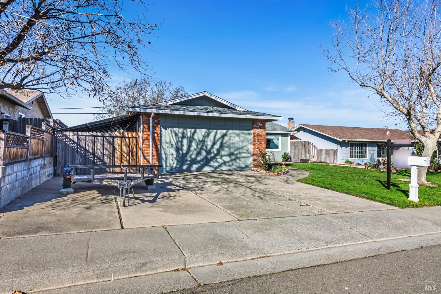 17 Amador Circle Rio Vista, CA 94571 - Photo 5 of 42 a view of a patio with a table and chairs under an umbrella