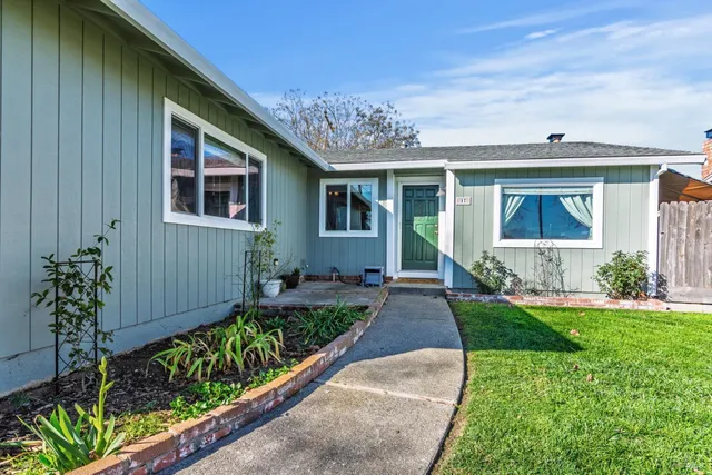a front view of a house with a yard