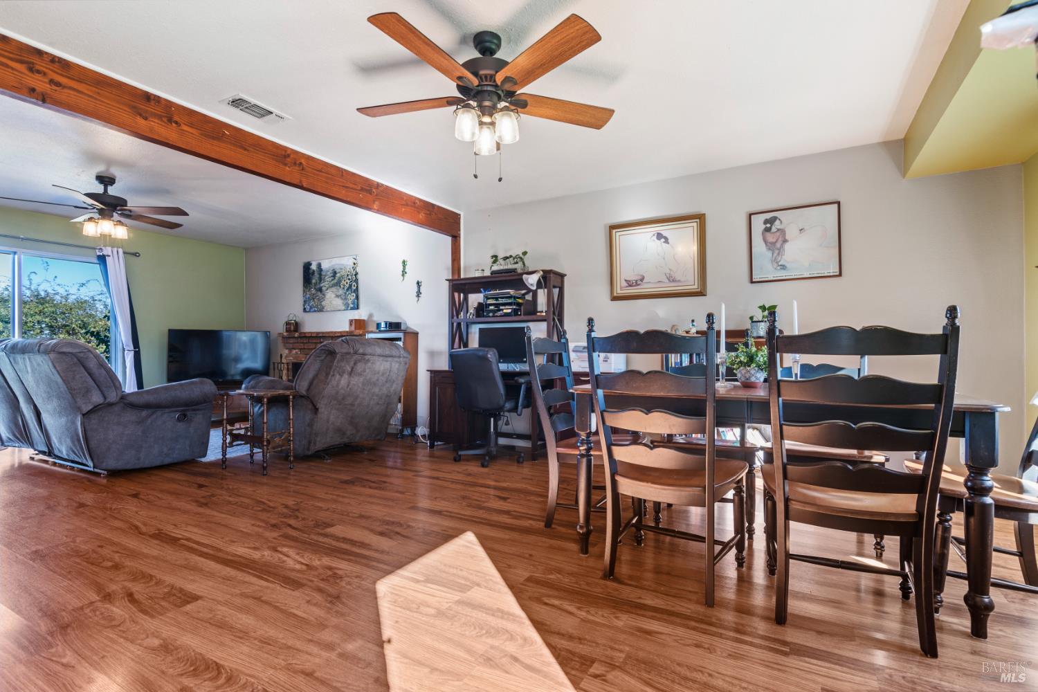 17 Amador Circle Rio Vista, CA 94571 - Photo 8 of 42 a living room with furniture a flat screen tv and a dining table