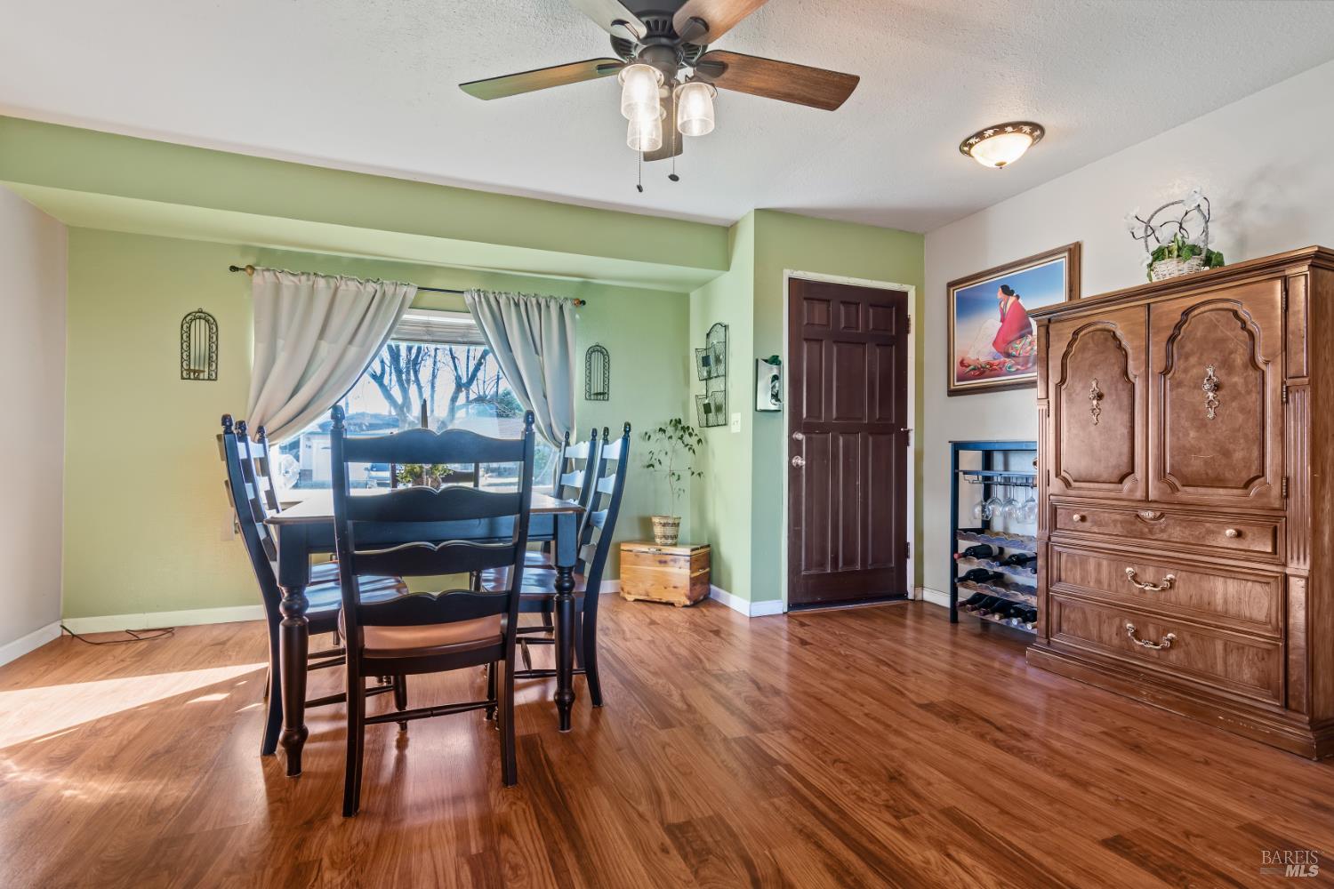 17 Amador Circle Rio Vista, CA 94571 - Photo 9 of 42 a view of a dining room with furniture window and wooden floor
