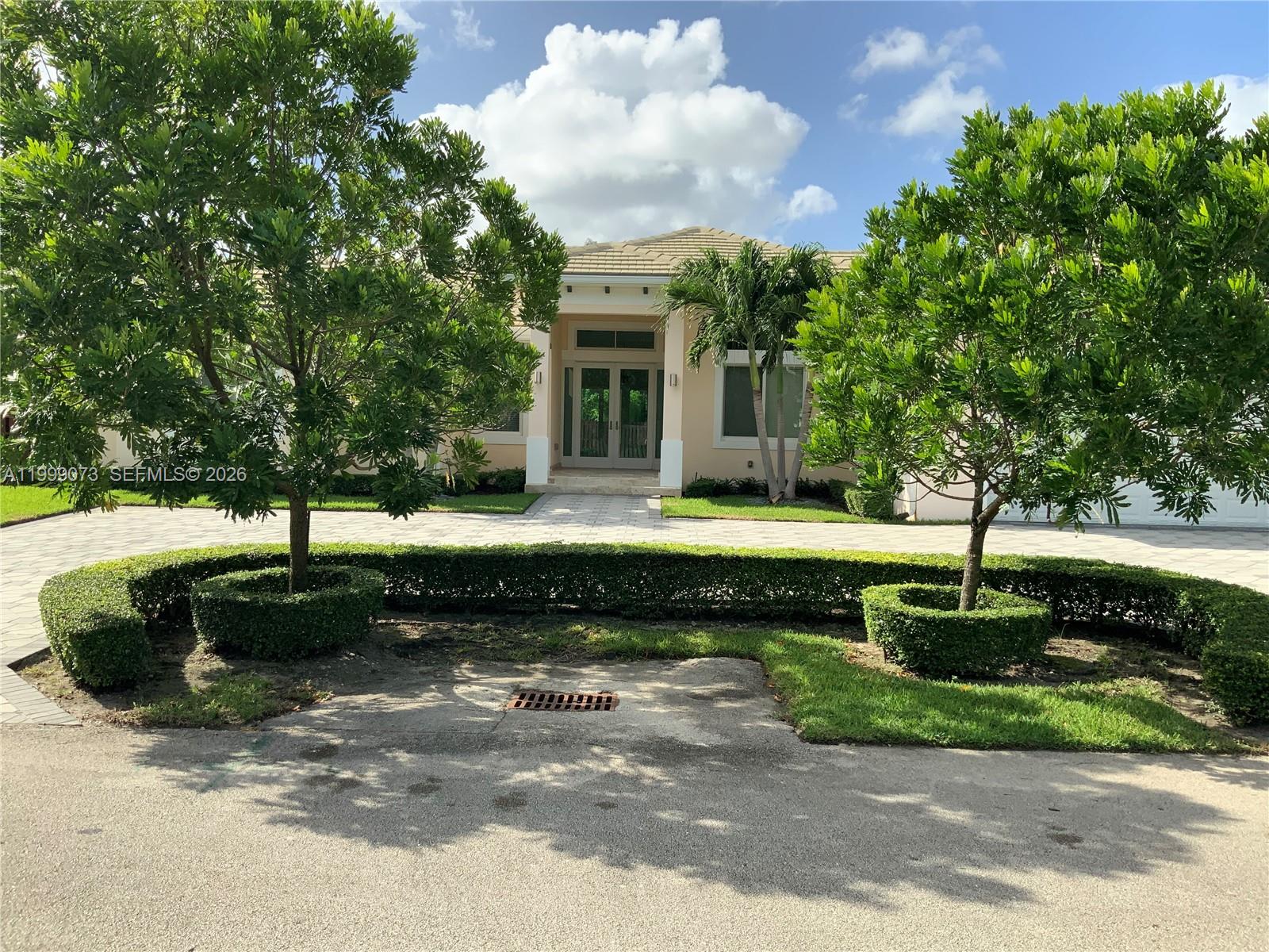 12308 Southwest 94th Place Miami, FL 33176 - Photo 1 of 21 a front view of a house with a yard