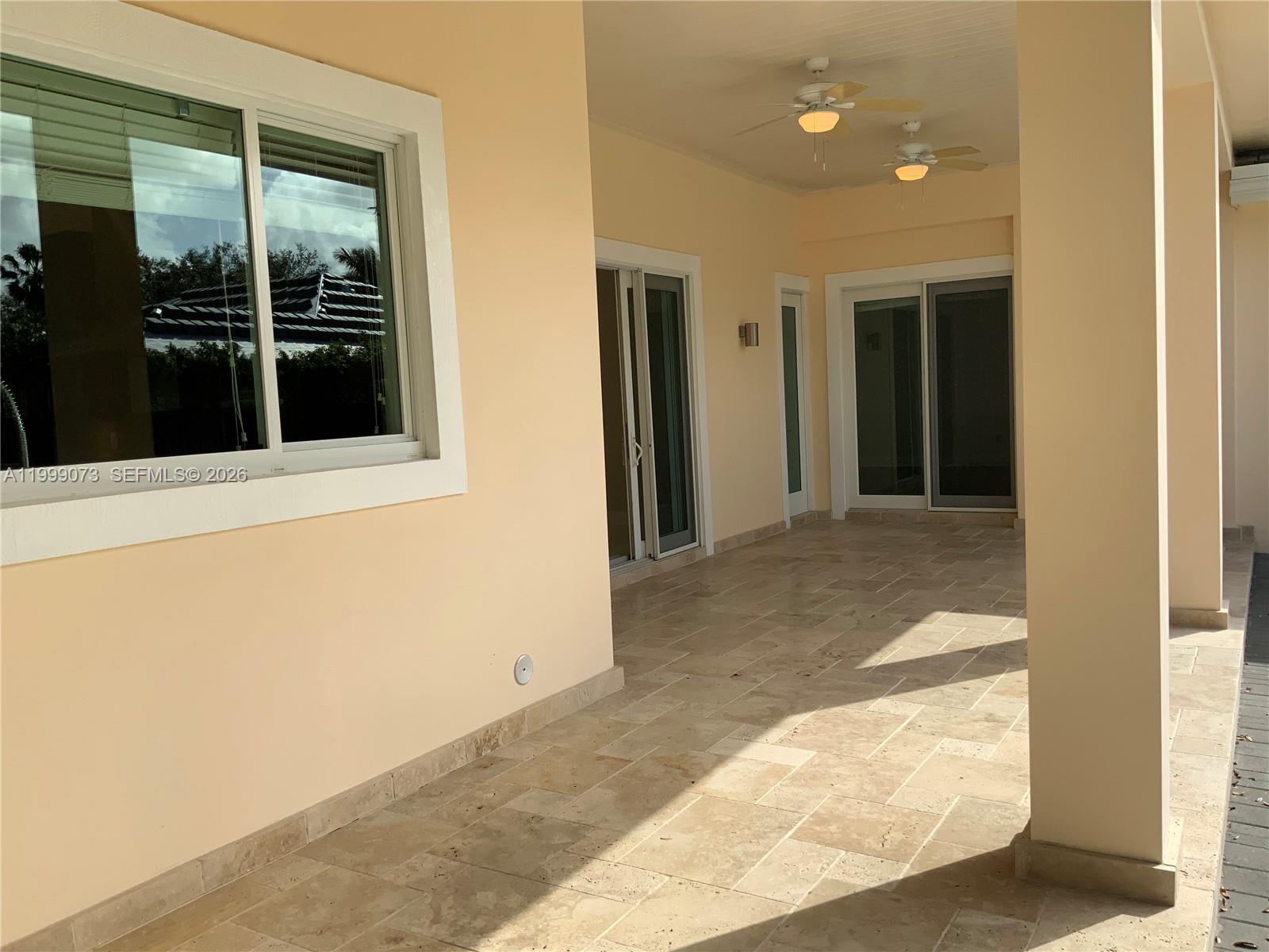 12308 Southwest 94th Place Miami, FL 33176 - Photo 12 of 21 a view of a hallway with wooden floor and a living room
