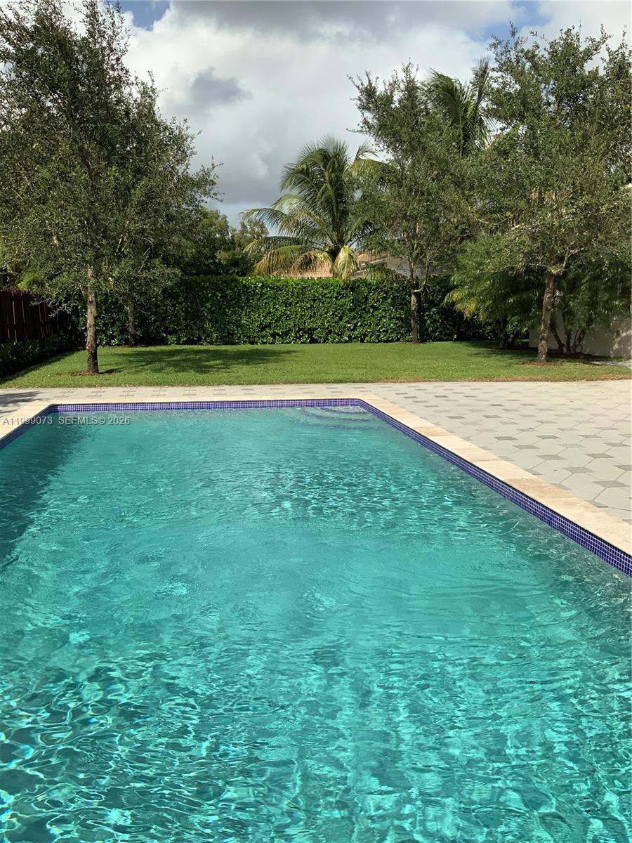 12308 Southwest 94th Place Miami, FL 33176 - Photo 14 of 21 a view of a swimming pool and a yard