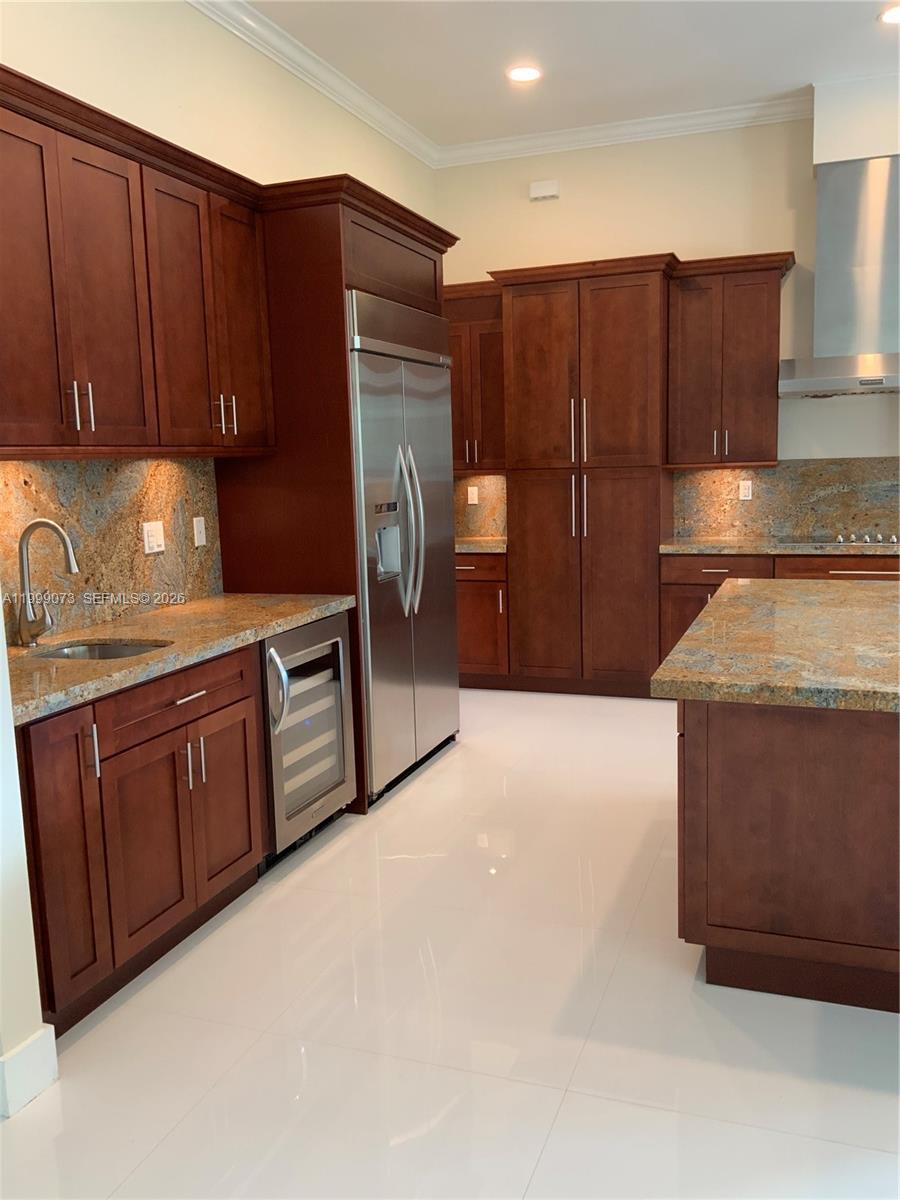 12308 Southwest 94th Place Miami, FL 33176 - Photo 8 of 21 a kitchen with stainless steel appliances granite countertop a refrigerator and a sink