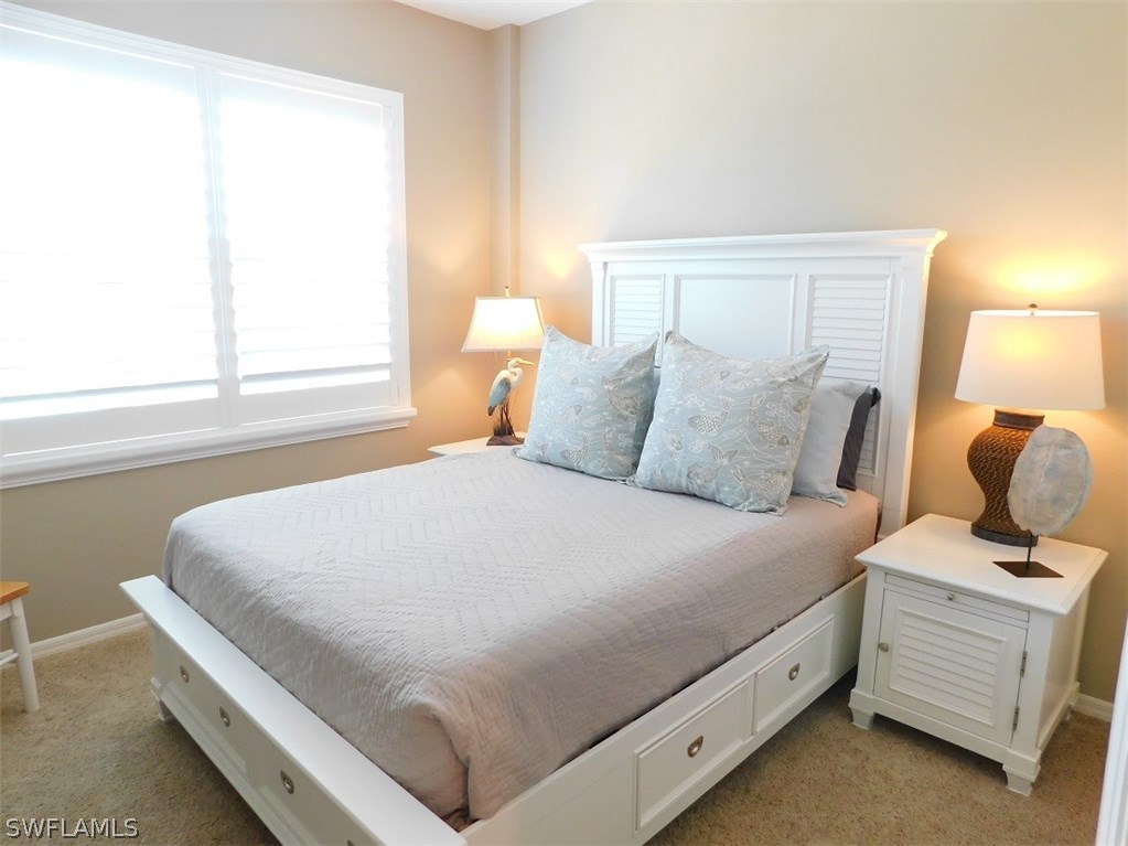 2090 Matecumbe Key Road, Unit 1307 Punta Gorda, FL 33955 - Photo 11 of 25 a bedroom with a bed and a window