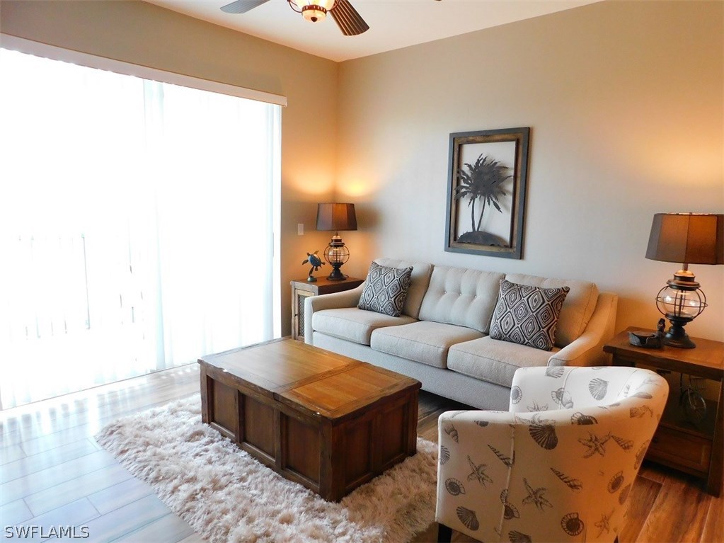 2090 Matecumbe Key Road, Unit 1307 Punta Gorda, FL 33955 - Photo 8 of 25 a living room with furniture and a potted plant