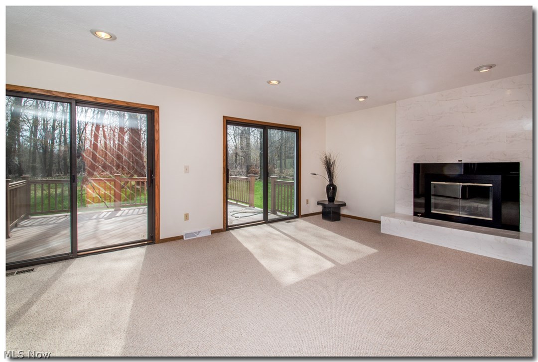 3455 Old Brainard Road Cleveland, OH 44124 - Photo 4 of 24 Huge Family Room with Gas Fireplace and Sliding Glass Doors Leading to the Deck
