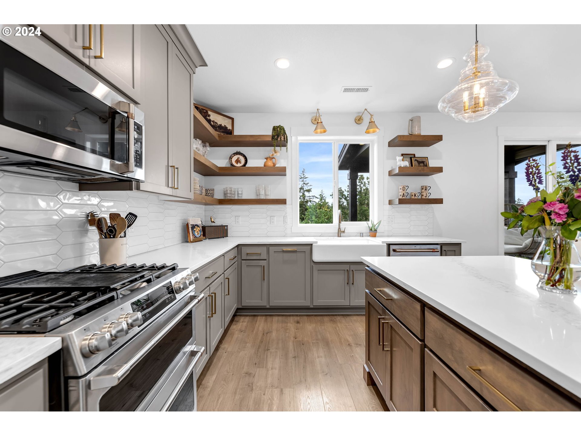 2017 North 2nd Way Ridgefield, WA 98642 - Photo 8 of 44 a kitchen with stainless steel appliances a sink a stove and cabinets