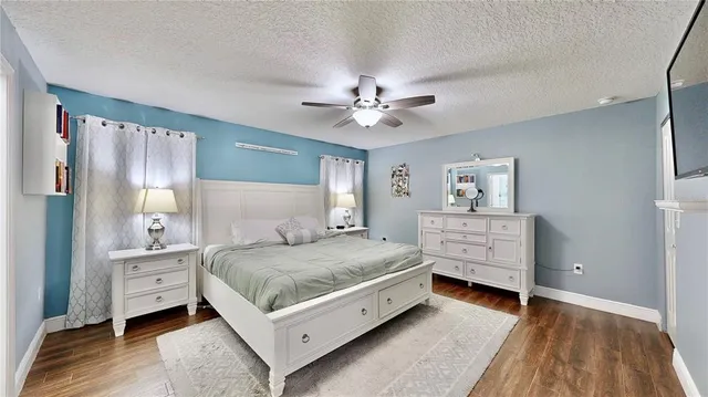 a room with a bed and a chandelier