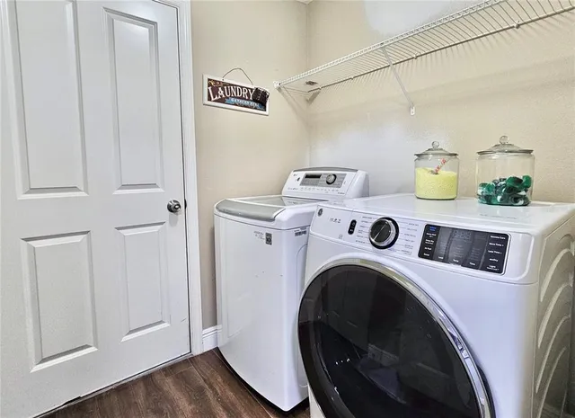 a utility room with dryer and washer