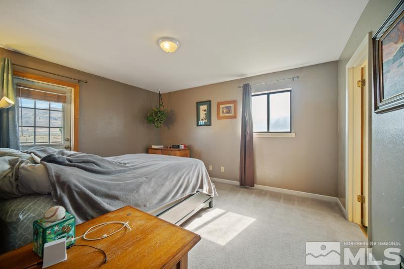 5100 Amy Road Reno, NV 89510 - Photo 12 of 35 a bedroom with a bed and window