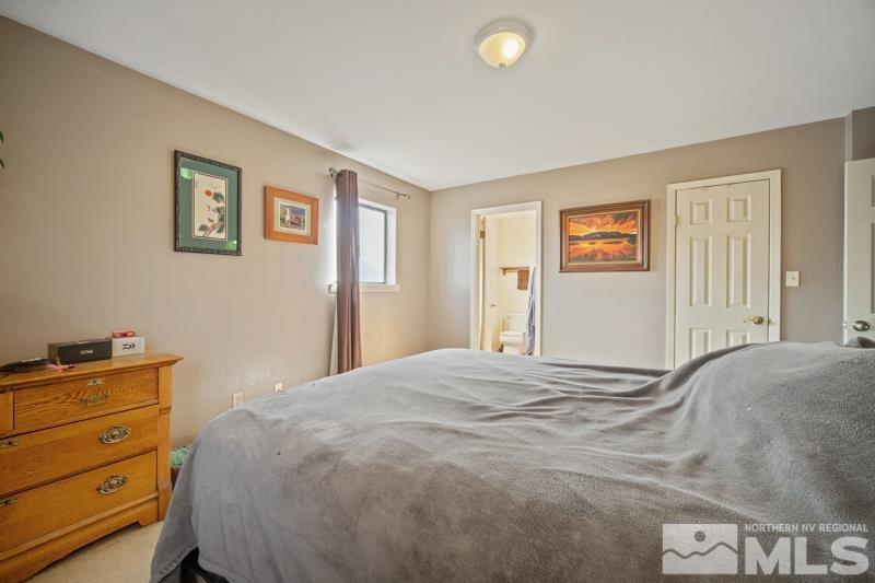 5100 Amy Road Reno, NV 89510 - Photo 14 of 35 a bedroom with a bed and a window