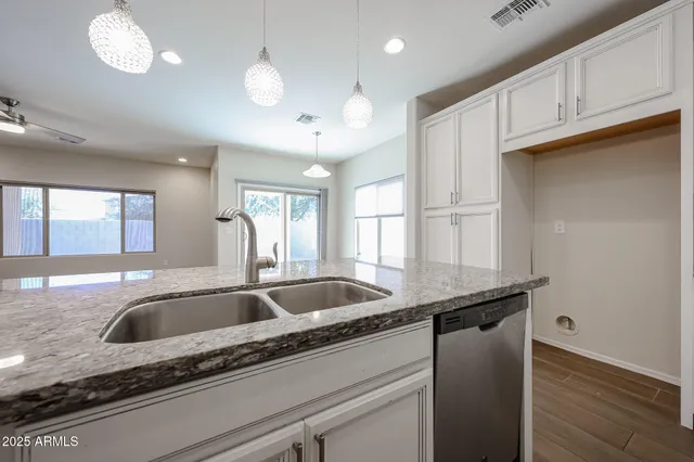 a kitchen with sink and window