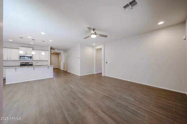 a view of kitchen with wooden floor and a kitchen