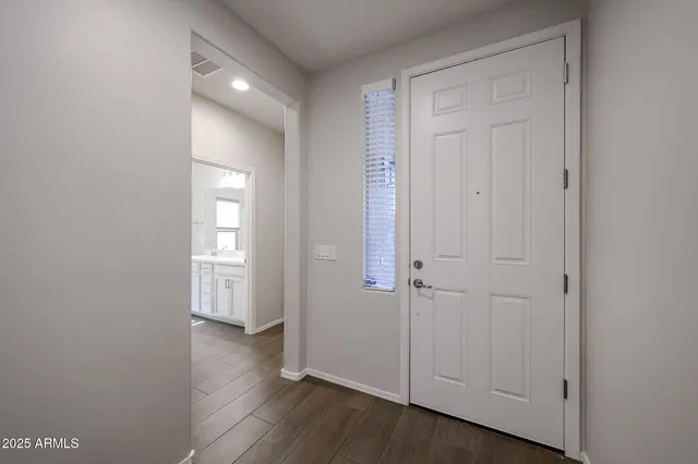 wooden floor with white walls