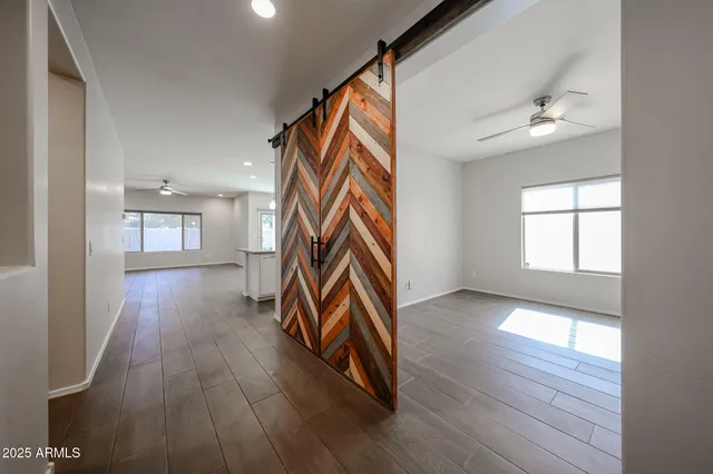 a view of an entryway and wooden floor