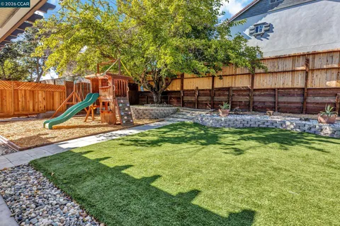 a view of a backyard with swimming pool