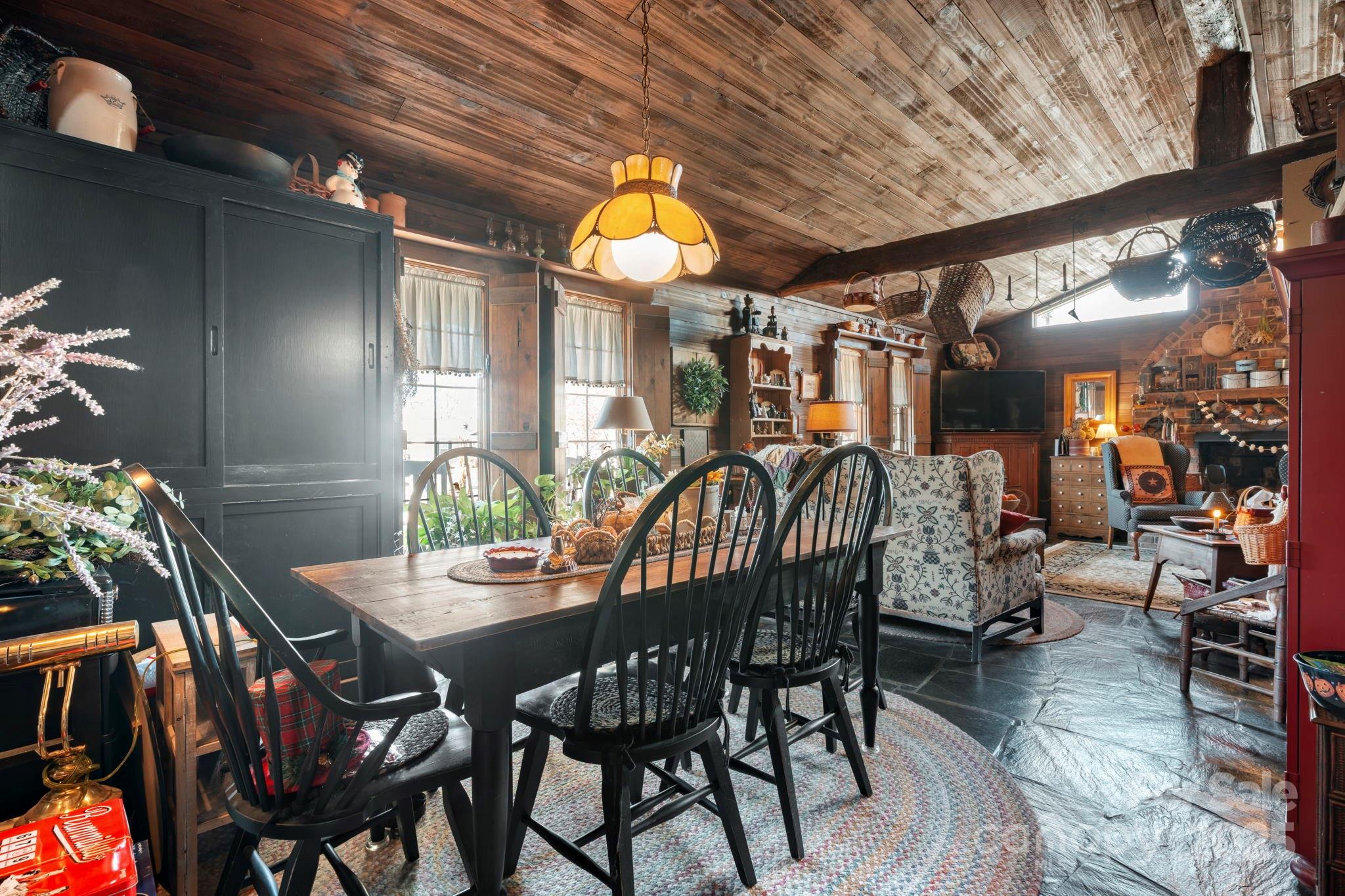 a dining room with furniture and window