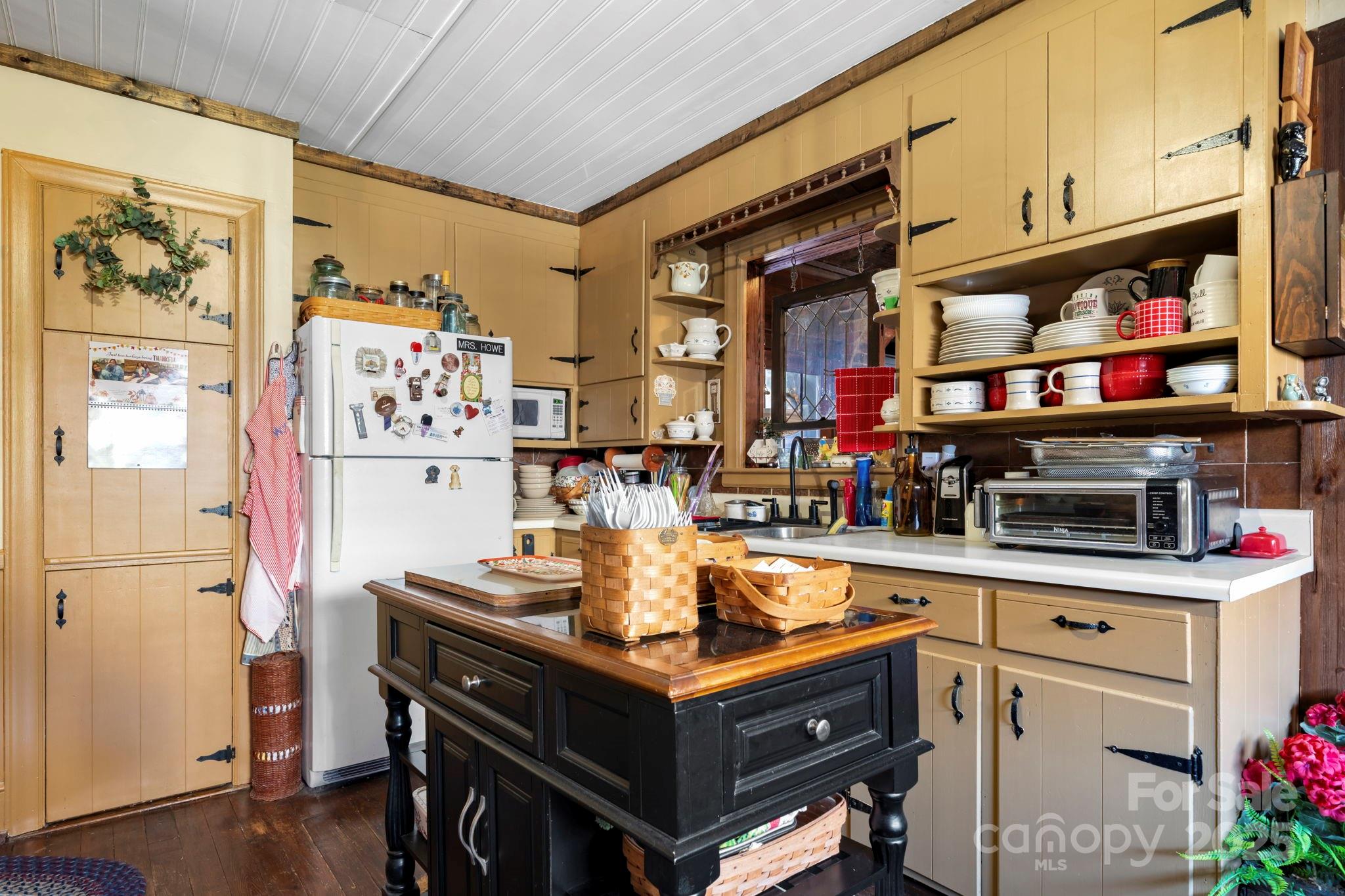 901 Union Street Maiden, NC 28650 - Photo 14 of 37 a kitchen with stainless steel appliances granite countertop a refrigerator and a stove top oven
