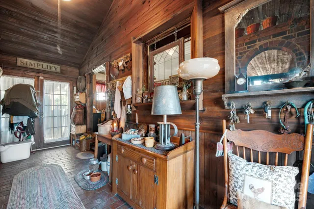 a dining room with furniture and wooden floor