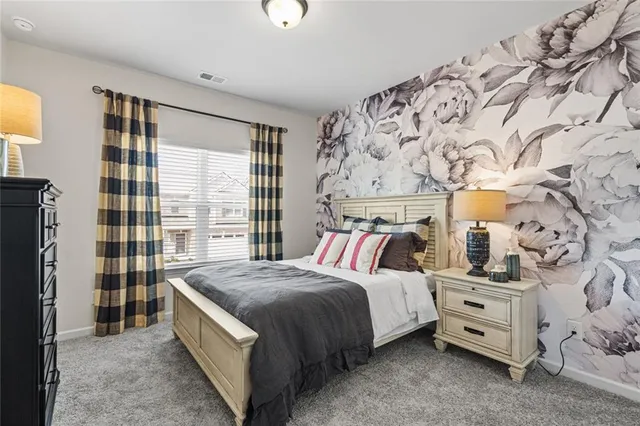 a living room with a large bed and a couch