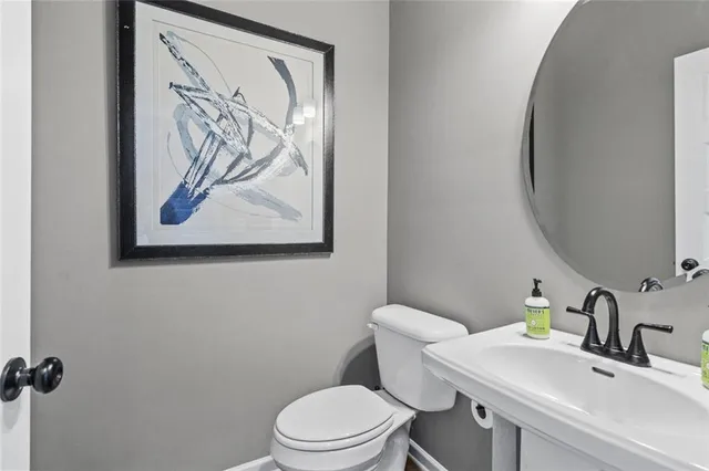 a bathroom with a toilet and a sink