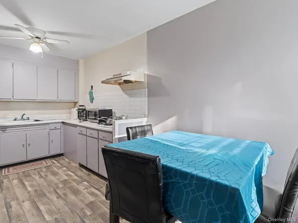 a kitchen with a sink a stove and cabinets