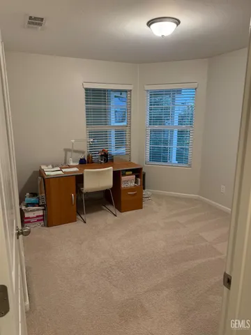 a view of a house with backyard