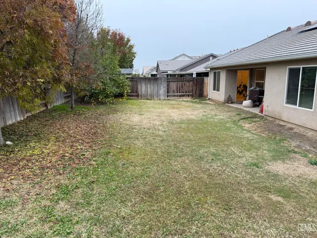 a house with yard in front of it