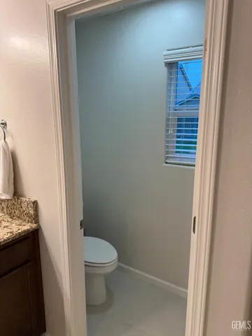 a bathroom with a toilet and a sink