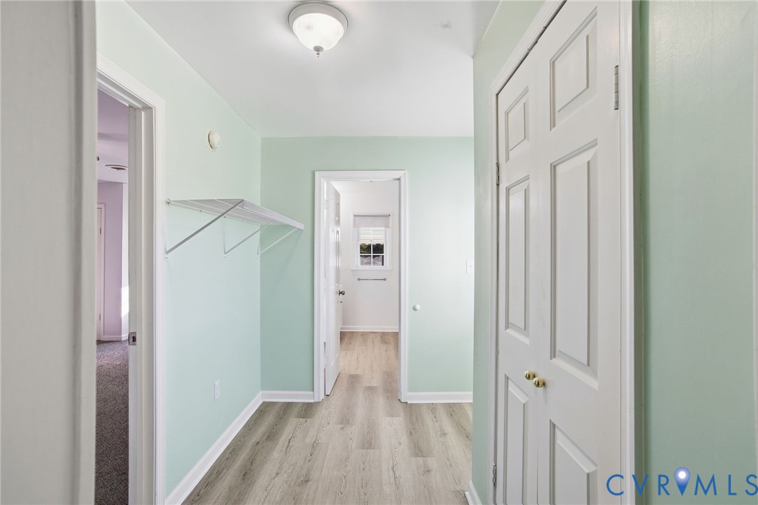 9102 Boydton Plank Road Petersburg, VA 23803 - Photo 11 of 32 a view of a hallway with wooden floor
