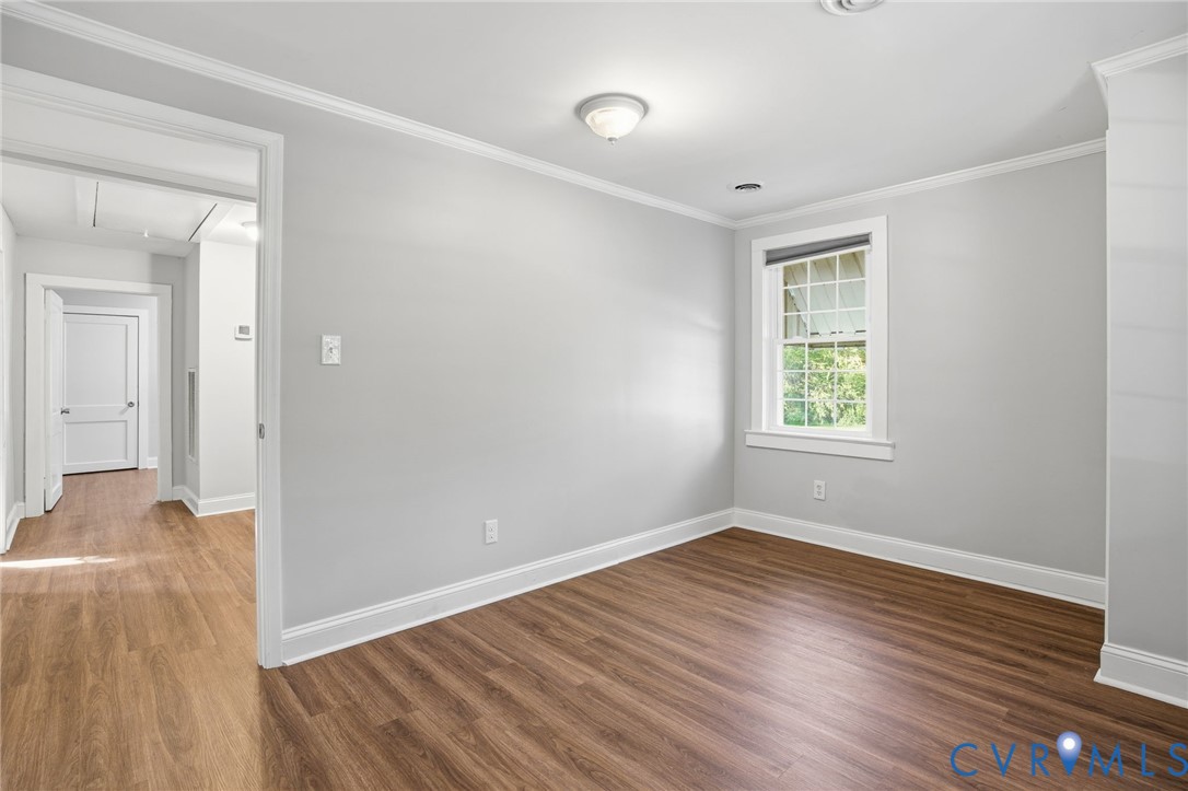 9102 Boydton Plank Road Petersburg, VA 23803 - Photo 18 of 32 wooden floor in an empty room with a window