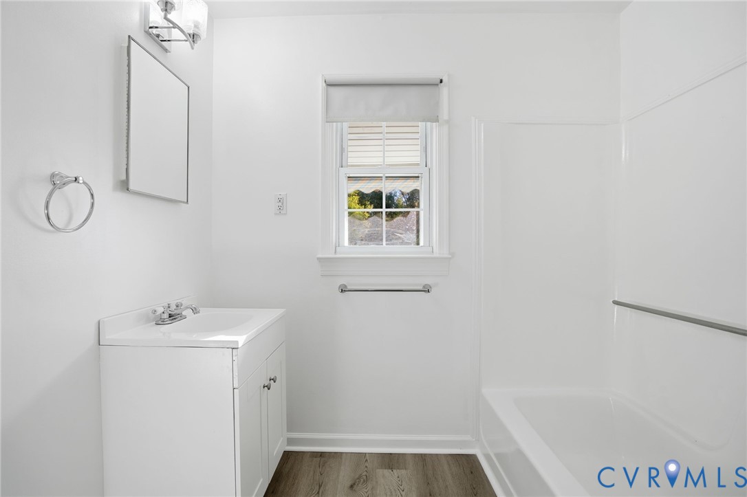 9102 Boydton Plank Road Petersburg, VA 23803 - Photo 20 of 32 a bathroom with a sink and a mirror