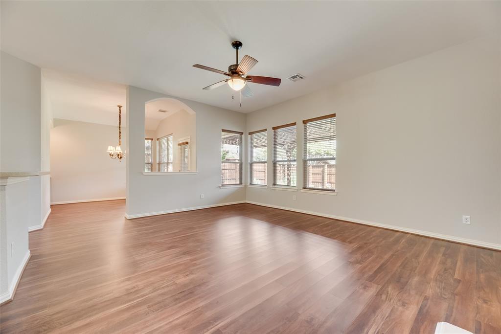 1522 Farm Dale Allen, TX 75002 - Photo 13 of 40 a view of an empty room with wooden floor and a window