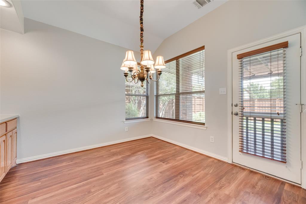 1522 Farm Dale Allen, TX 75002 - Photo 14 of 40 a view of an empty room with wooden floor and a window