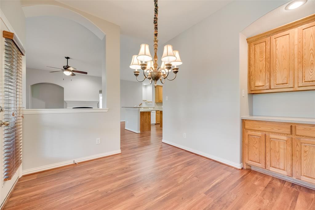 1522 Farm Dale Allen, TX 75002 - Photo 15 of 40 a view of a kitchen with wooden floor and a window