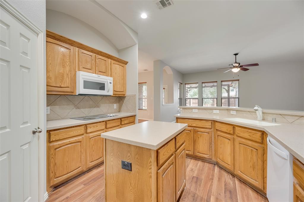 1522 Farm Dale Allen, TX 75002 - Photo 16 of 40 a kitchen with stainless steel appliances granite countertop a sink stove and cabinets