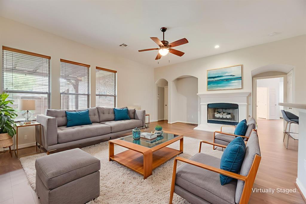 1522 Farm Dale Allen, TX 75002 - Photo 2 of 40 a living room with furniture fireplace and a window