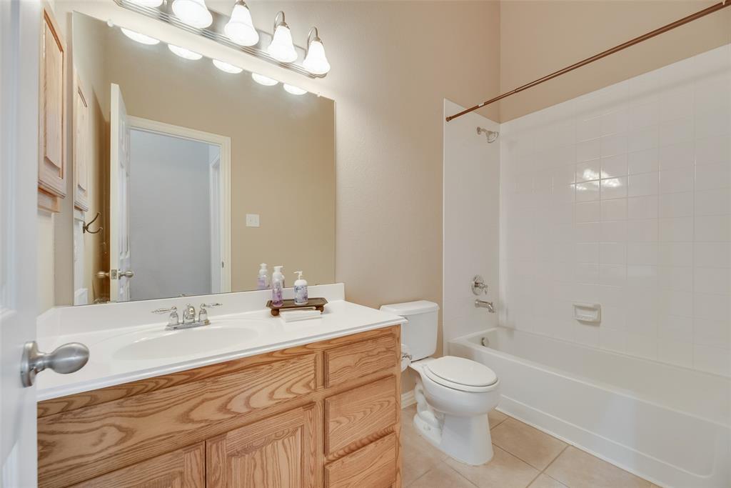1522 Farm Dale Allen, TX 75002 - Photo 26 of 40 a bathroom with a double vanity sink toilet mirror and bathtub