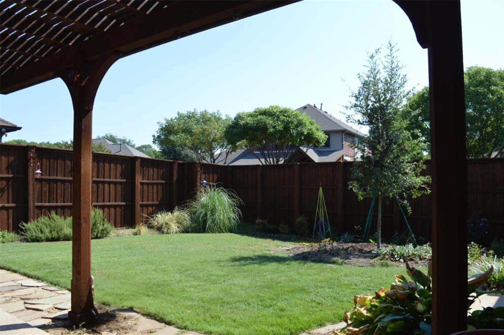 1522 Farm Dale Allen, TX 75002 - Photo 32 of 40 a view of a backyard with potted plants and wooden fence