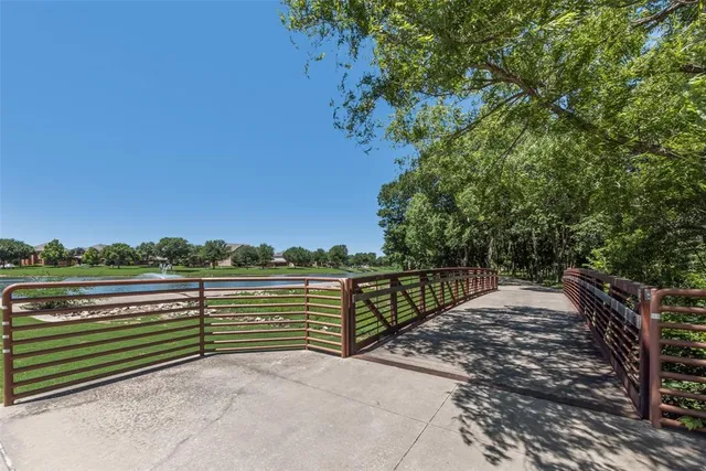 an aerial view of a house with a yard and outdoor seating