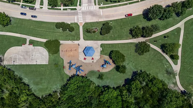 a view of a park with swings and slides