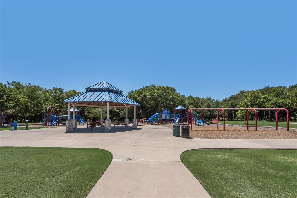 1522 Farm Dale Allen, TX 75002 - Photo 39 of 40 a view of a park with swings and slides
